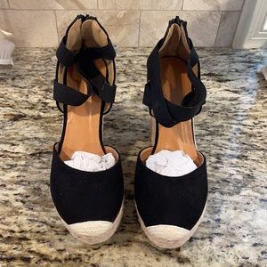 Brand new pair of black platforms